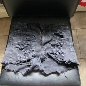 Black ripped jean shorts.